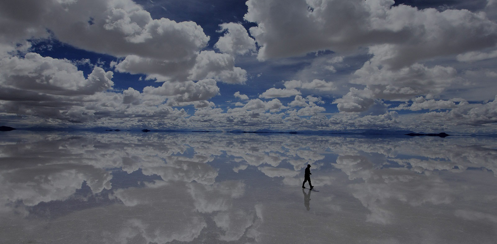 The dreamer is a man with his feet strongly resting on clouds.